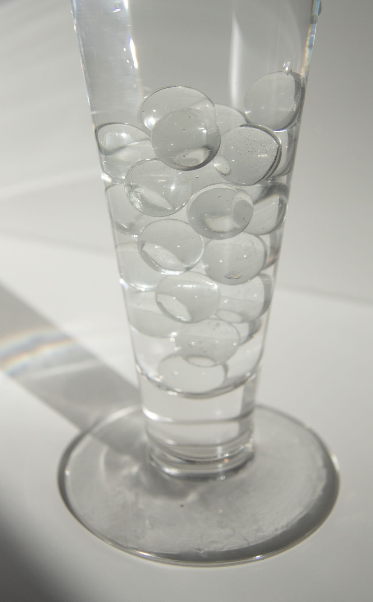 Close-up of clear water-filled gel beads