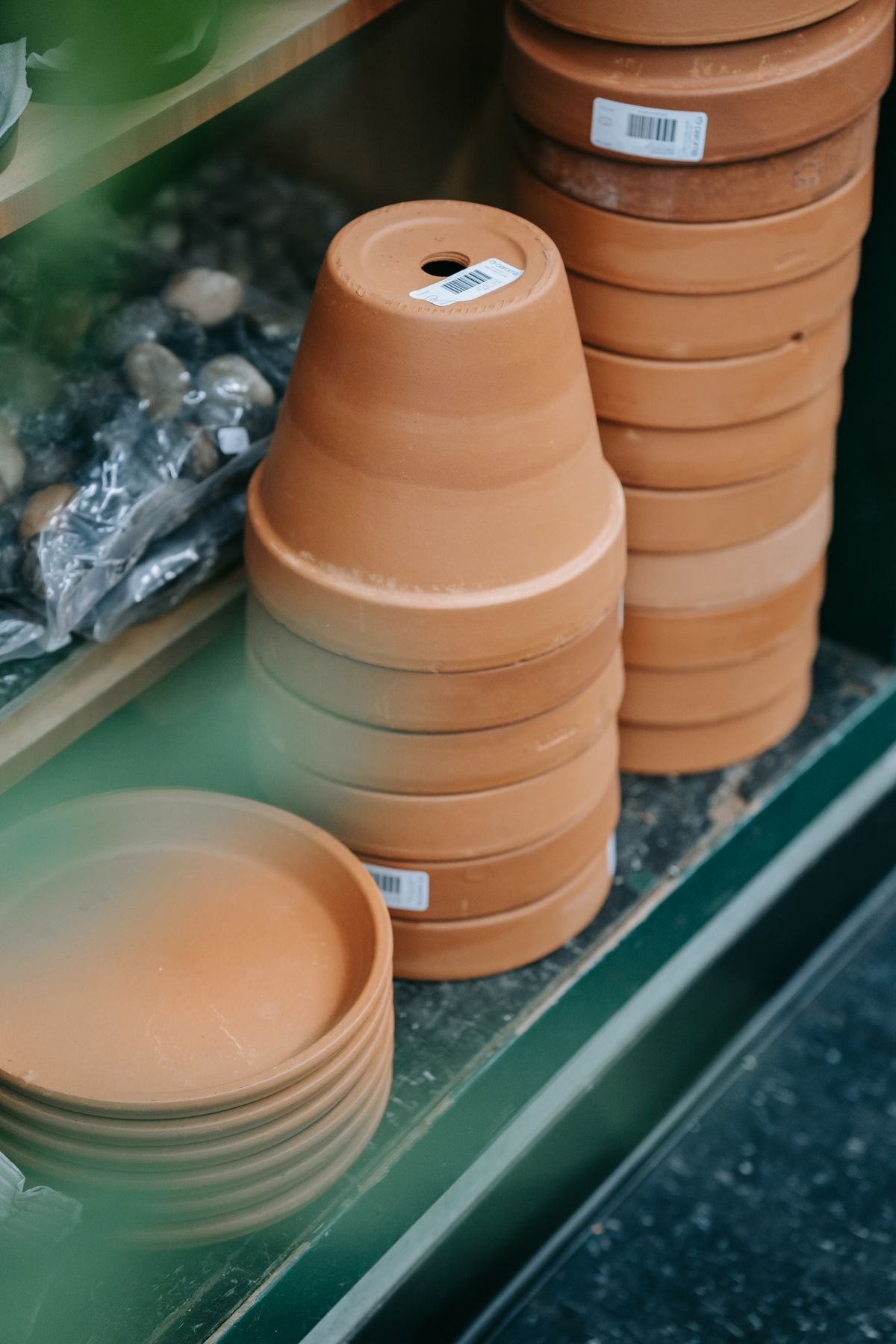 Stacked terracotta pots of varying sizes, illustrating the range of diameters relevant to sizing a Peperomia pot correctly
